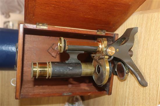 A cased brass microscope